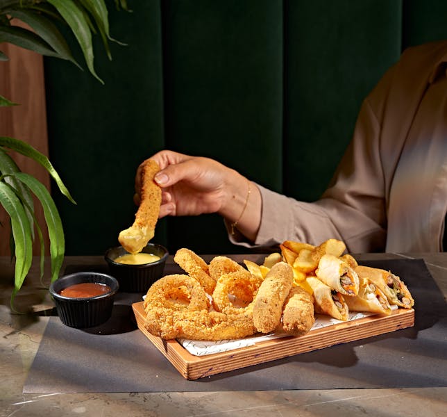 Mozzarella sticks appetizer with dipping sauce
